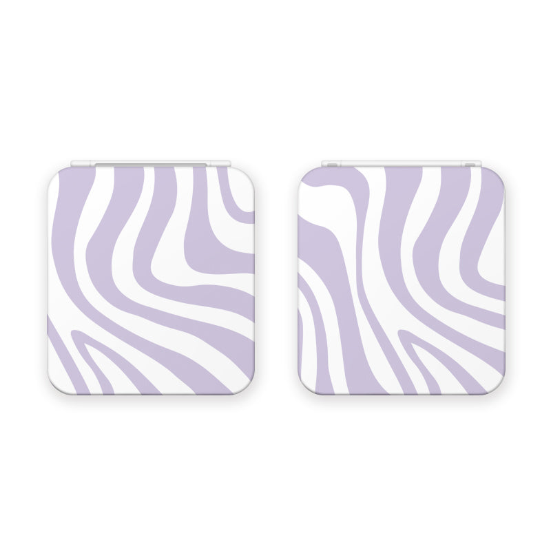 Two square-shaped, white zebra-print game card boxes for Nintendo Switch with rounded edges. The boxes are slightly open, showing the design on the outer shell. Perfect for any cozygamer setup, the wavy, fluid stripes add a touch of style.