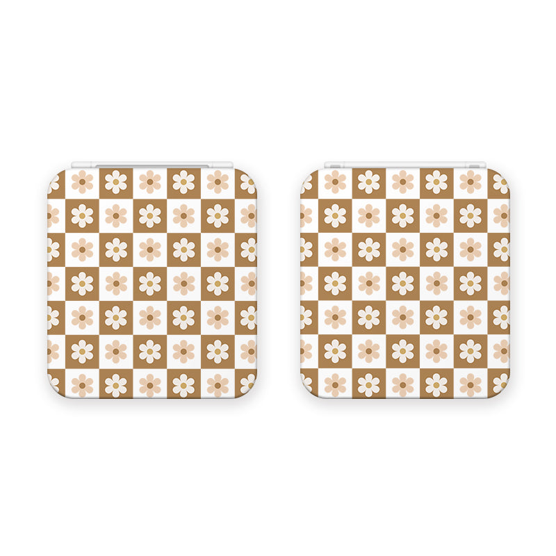 Two square, white luggage tags featuring a repeated pattern of beige and white flowers on a cream background. Each tag has rounded corners and white straps for attachment, mirroring the sleek design of the Cozy Checkered Flowers Game Card Box for Nintendo Switch by petimint.