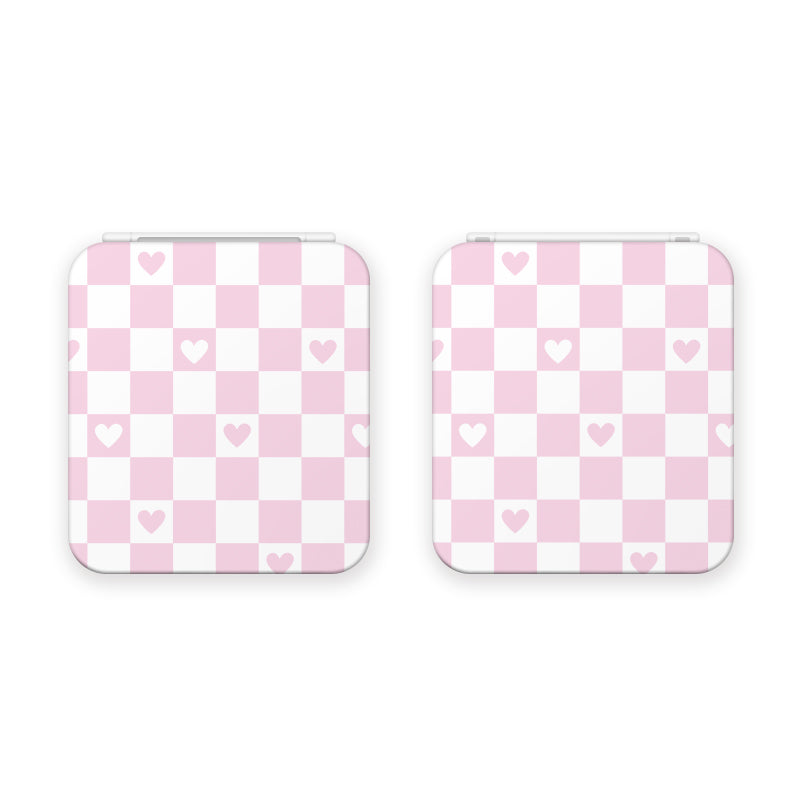Two square compact mirrors, elegantly designed with a white and pink checkered pattern adorned with small pink hearts, ideal for complementing your gamer style. These Checkered Love Game Card Boxes for Nintendo Switch by petimint are displayed side by side on a pristine white background.