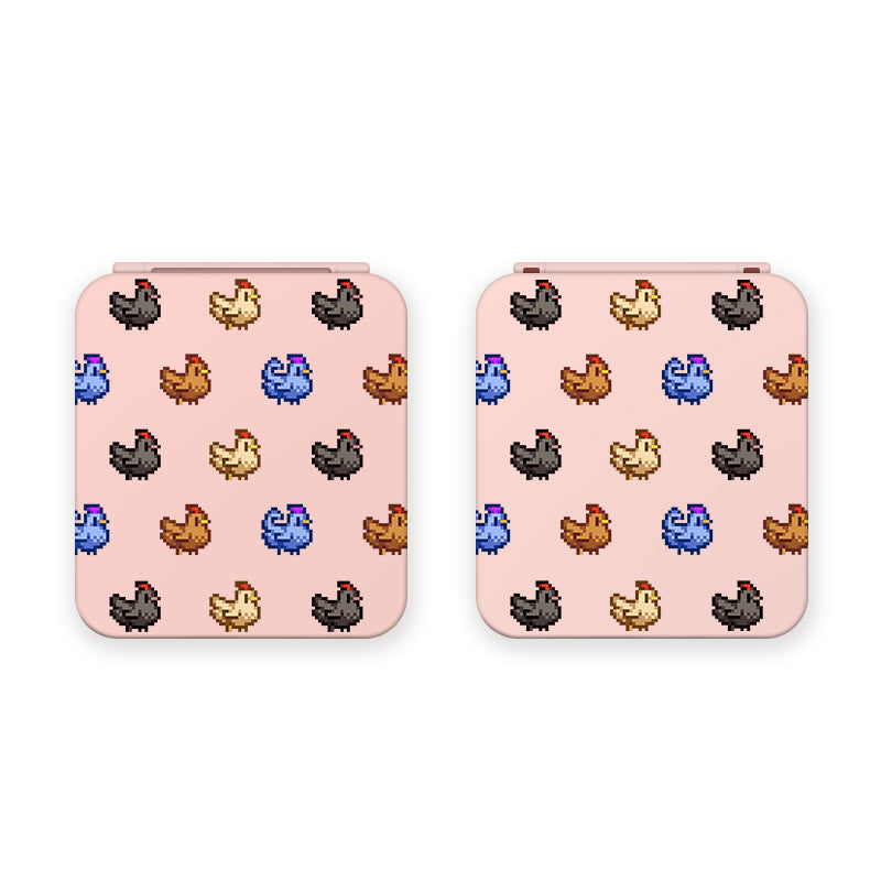 Introducing the Chicken Stardew Valley Game Card Box for Nintendo Switch by petimint: two square, light pink boxes adorned with a playful and retro-inspired repeating pattern of pixel-art style chickens in various colors—brown, blue, black, and yellow. Perfect for any cozygamer seeking to add a touch of nostalgia to their Nintendo Switch accessories.