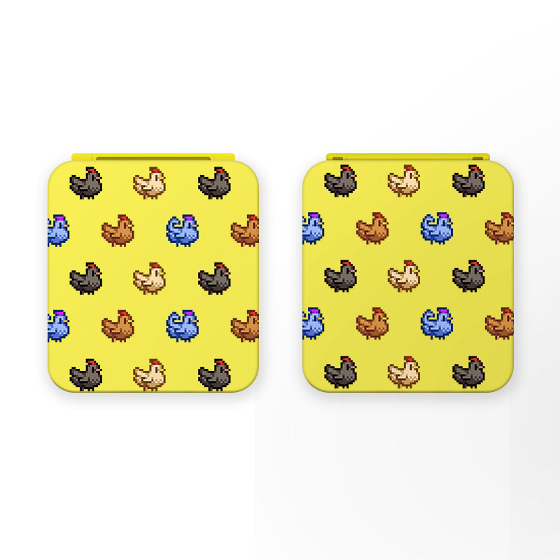 A Chicken Stardew Valley Game Card Box for Nintendo Switch by petimint, featuring a playful design with pixelated chickens in various colors—red, blue, brown, black, and yellow—arranged in neat rows and columns. This square yellow box's retro video game graphic is perfect for any cozygamer's setup.