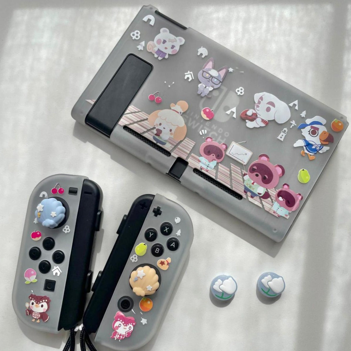 The Chibi Animal Crossing Case for Nintendo Switch by petimint features cute animal-themed stickers and thumb grips. The console cover displays cartoon animals in various poses, while the Switch grip case offers excellent comfort. Plus, the dockable case design allows you to conveniently switch between handheld and TV modes.