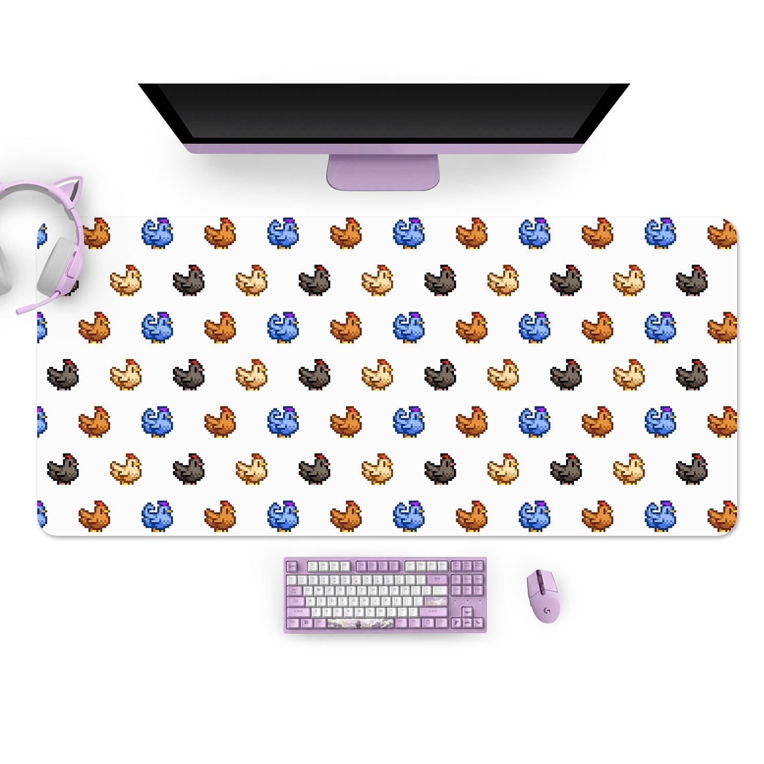 Image of a cozy gamer setup featuring a black monitor, purple cat ear headphones, a purple mechanical keyboard, and a purple mouse. The desk mat is the petimint Stardew Chicken Mouse Pads Pc Gaming Accessories, adorned with a repeating pattern of pixelated chubby dinosaur icons in blue, brown, orange, gray, and beige.