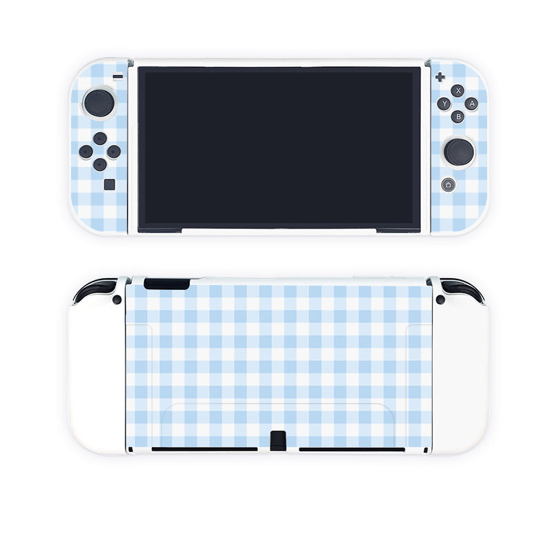 The Picnic Case for Nintendo Switch by petimint features a stylish blue and white gingham pattern skin. The product is shown from both the front and back views: the front view displays the screen and controls, while the back view highlights the patterned skin covering the rear. This case is perfect for adding a touch of stylish flair to your gaming experience.