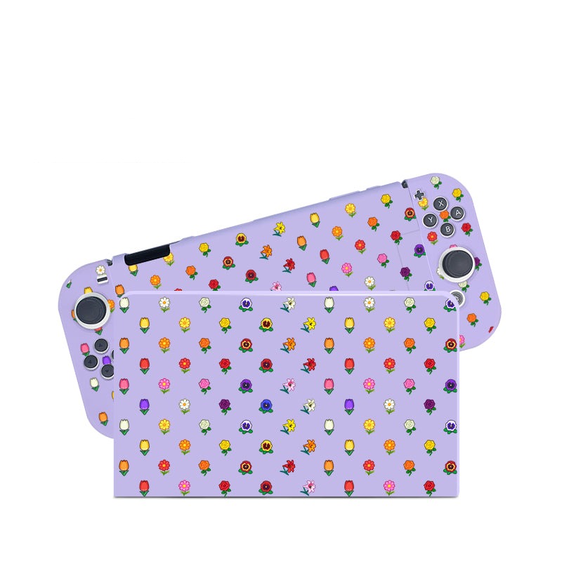 Introducing the Flower Crossing Case for Nintendo Switch by petimint – a lavender-colored gaming console case adorned with a vibrant pattern of colorful flowers and plant icons. Perfect for the cozygamer, this case allows all buttons and joysticks to remain visible while offering a lively and playful design that complements any gamer's style.