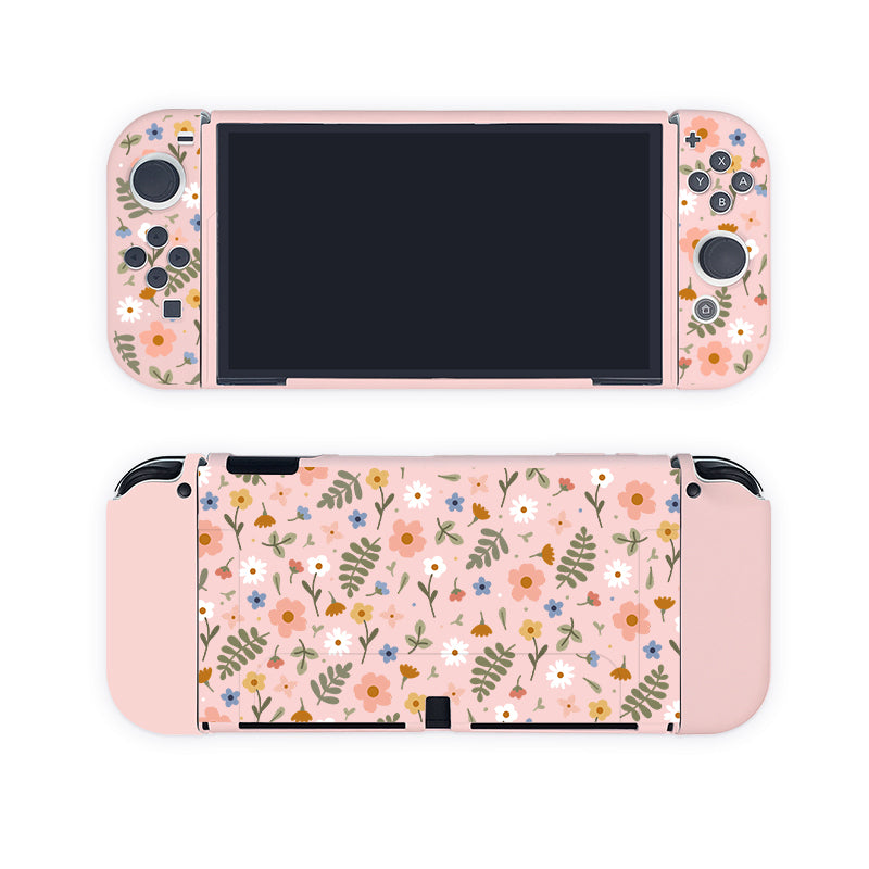 Introducing the Spring Case for Nintendo Switch by petimint: a pastel pink handheld gaming console case adorned with a whimsical floral pattern. The design showcases various flowers and leaves in subdued colors, giving your Nintendo Switch a decorative and charming appearance perfect for any gamer. This case seamlessly blends style and functionality, reminiscent of detachable controllers like those found on the popular console.