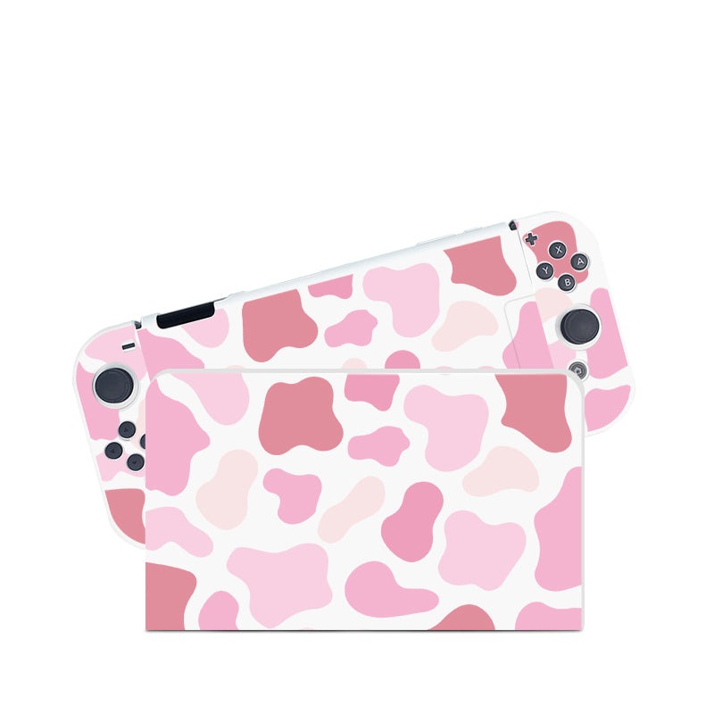 Introducing the petimint Strawberry Cow Case for Nintendo Switch: a handheld gaming console accessory featuring a pink and white cow print design, complemented with a soft TPU switch grip case to ensure both comfort and style.