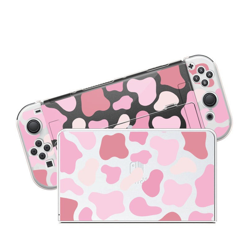 Petimint's Strawberry Cow Case for Nintendo Switch showcases a playful and vibrant pink, white, and dark gray camouflage pattern covering the front and back. It includes controllers with this unique design and comes with a soft TPU switch grip case for extra comfort during long gaming sessions.