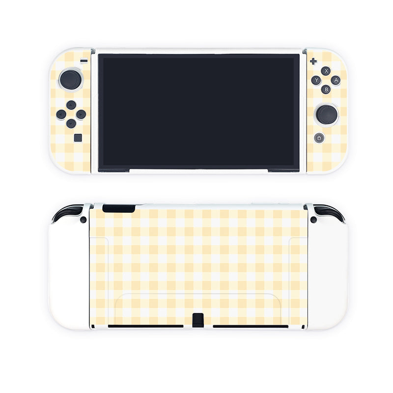 Introducing the Picnic Case for Nintendo Switch by petimint, a stylish accessory in a delightful yellow checkered design. The front highlights the screen and essential buttons, while the back showcases the full checkered pattern, seamlessly blending fashion and gaming.