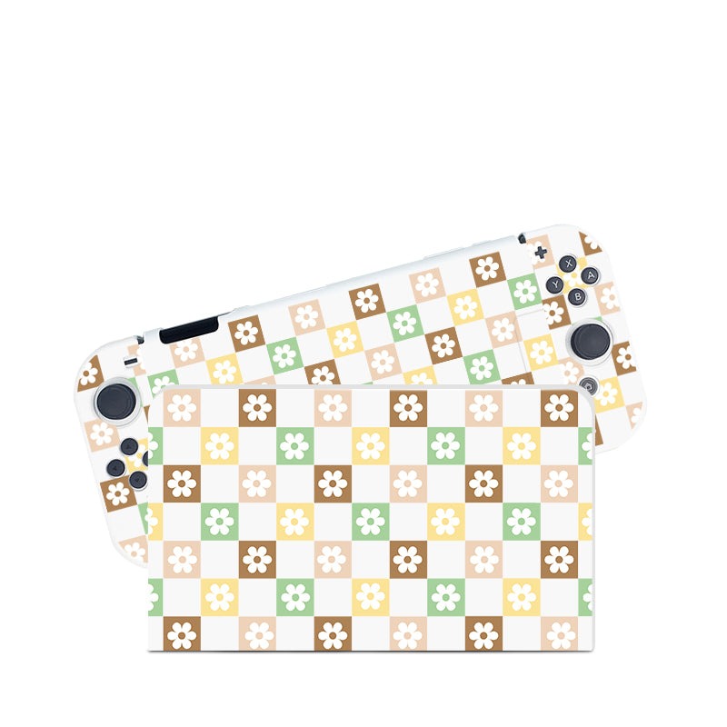 The Checkered Seasonal Flowers Case for Nintendo Switch by petimint is a perfect fit for any cozygamer. This colorful, retro-style case features a checkered pattern with squares in pastel shades of yellow, green, brown, and white, each containing a small floral design. The console's buttons and joysticks remain visible through the white case.