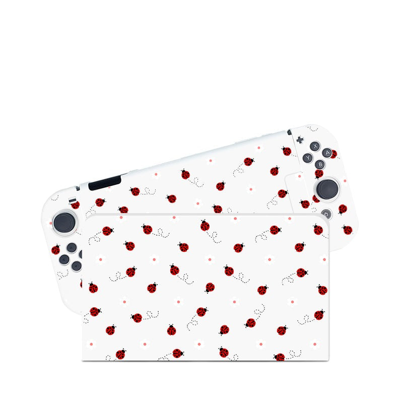 A cozygamer’s dream, the Little Ladybug Case for Nintendo Switch by petimint features a whimsical white design adorned with small red ladybugs and black dotted lines. The console's buttons and joystick are visible, seamlessly complementing the playful case.