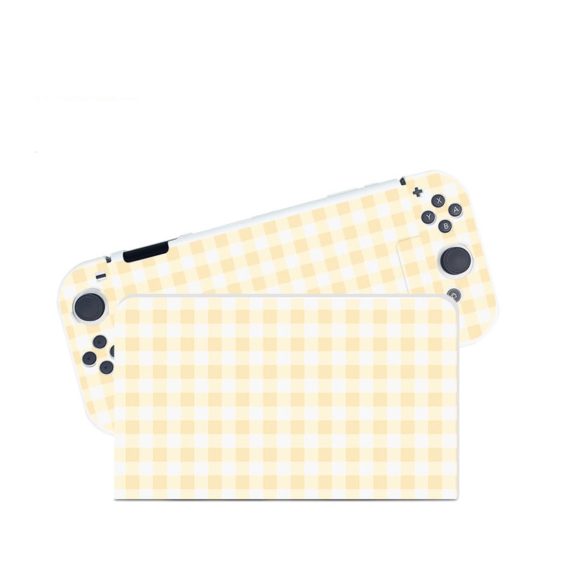 Introducing the Picnic Case for Nintendo Switch by petimint: a handheld gaming console protector featuring a charming light yellow and white gingham checkered pattern. The Cozygamer console cover comes with two detachable side covers, each displaying the same delightful design, complete with visible joystick and button configurations.