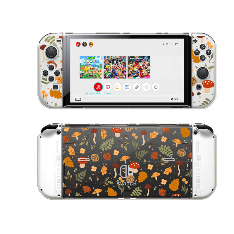 Introducing the Cozy Autumn Case for Nintendo Switch by petimint. This handheld gaming console accessory features controllers attached and showcases a delightful nature-themed design with leaves, mushrooms, and acorns. The screen displays various game icons while the back presents a sophisticated darker leafy pattern. Crafted from soft TPU material in a clear color, it offers a comfortable grip and is perfectly dockable for your convenience.