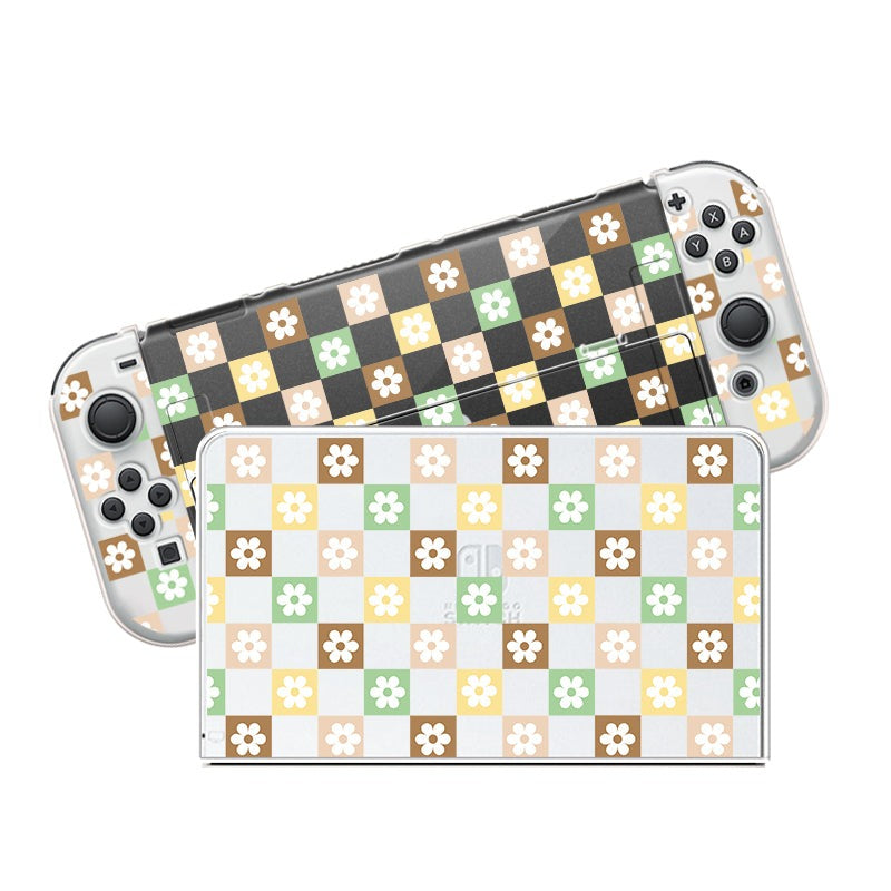 The petimint Checkered Seasonal Flowers Case for Nintendo Switch, in clear color, adorns a handheld gaming console and its dock with checkered squares featuring floral designs in shades of yellow, green, brown, and white. Shown side by side, the dock and console exhibit their matching design vividly.