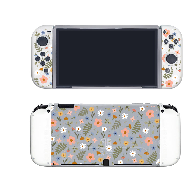A semi-clear Spring Case for Nintendo Switch by petimint featuring a stunning floral design. The front is adorned with buttons and joysticks accented with floral motifs, while the back boasts a fully covered pattern of orange, pink, and white flowers interwoven with green leaves on a light grey background, making it just as stylish as your favorite gaming apparel.
