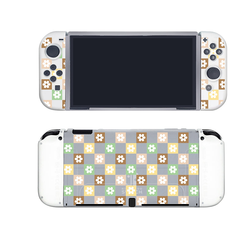 A Checkered Seasonal Flowers Case for the Nintendo Switch, created by petimint, is pictured from both the front and back. The case features a semi-clear decorative skin showcasing a colorful checkered pattern with shades of brown, green, white, and light gray. Each square is adorned with small white flowers in the center—an ideal accessory for any cozygamer.