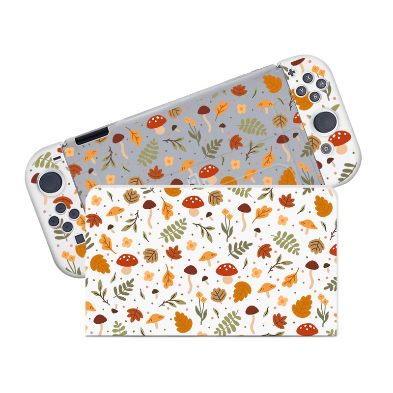 The Cozy Autumn Case for Nintendo Switch by petimint is a gaming console accessory that includes detachable controllers and a dockable case, all adorned with an autumnal theme. The design showcases leaves, mushrooms, and acorns in shades of orange, red, brown, and green on a white and gray background.