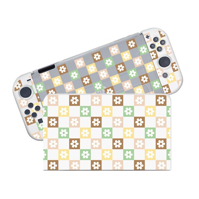 Introducing the Checkered Seasonal Flowers Case for Nintendo Switch by petimint—an exquisite gaming console case adorned with an elegant checkered pattern. The alternating pastel colors of beige, brown, green, and yellow grace each square, while a charming white daisy-like flower adds a touch of floral beauty at the center. This semi-clear case is the perfect blend of aesthetics for the cozygamer.