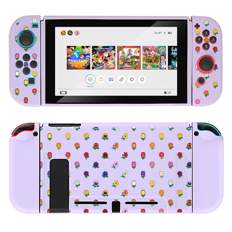 A cozygamer's dream, this Nintendo Switch adorned with custom lilac Joy-Con controllers and a Flower Crossing Case by petimint is shown. The screen displays the home menu, while the back of both the console and controllers features a colorful pattern of small plant and flower icons.