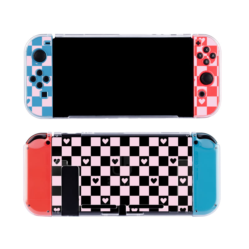 A Nintendo Switch in the Checkered Love Case from petimint, featuring a vibrant design: the left controller showcases a blue and black checkerboard pattern, while the right flaunts a pink and black checkerboard design. The back of this cozygamer console is adorned with a stylish black and pink checkerboard pattern with hearts interspersed.