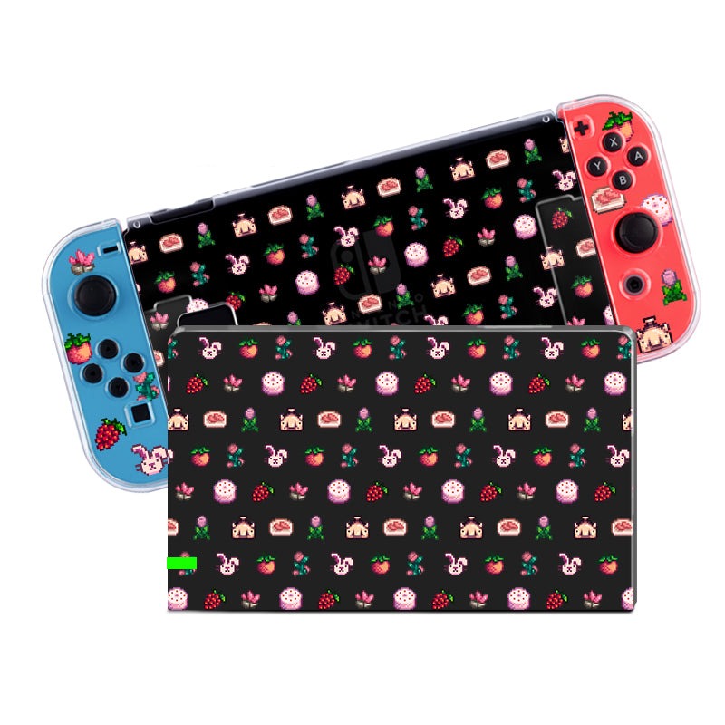 The Pink Stardew Items Case for Nintendo Switch from the brand petimint is depicted with a strawberry-themed design. The left Joy-Con is blue, adorned with a small pink character and strawberries, while the right Joy-Con is red, featuring strawberries and desserts. The background showcases various sweets and strawberries, making it an ideal addition to any cozygamer's setup.