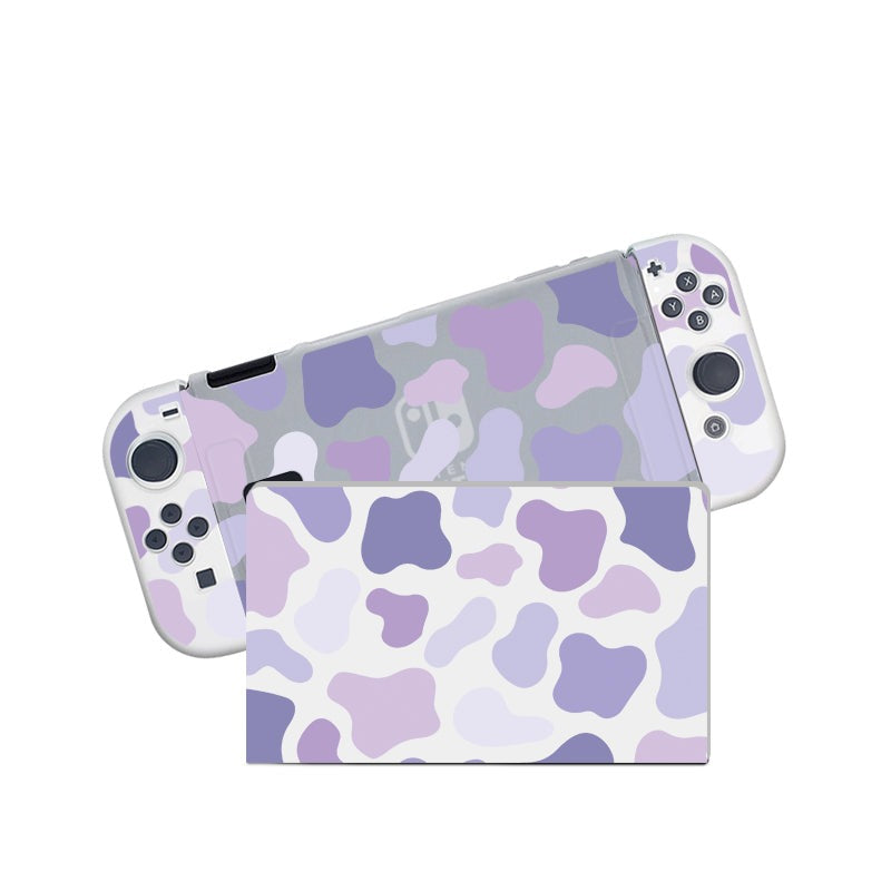 Introducing the Lilac Cow Case by petimint for your Nintendo Switch, a semi-clear handheld gaming console case featuring a charming pastel purple and white camo design. Perfect for any cozygamer, this stylish accessory covers both the controllers and dock station, showcasing the front and back of your device in split parts.