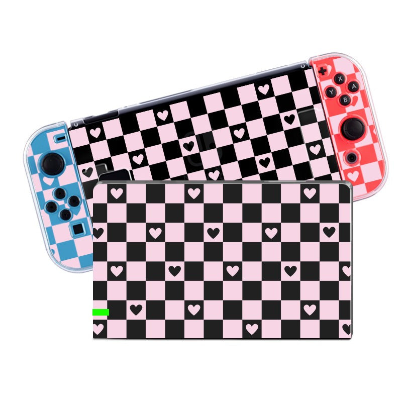 Experience the ultimate cozygaming experience with the Checkered Love Case for Nintendo Switch by petimint. This clear protective skin features a delightful black and pink checkered pattern adorned with small pink hearts. It perfectly complements your console, which comes with blue and red Joy-Con controllers, all covered in the same charming design.