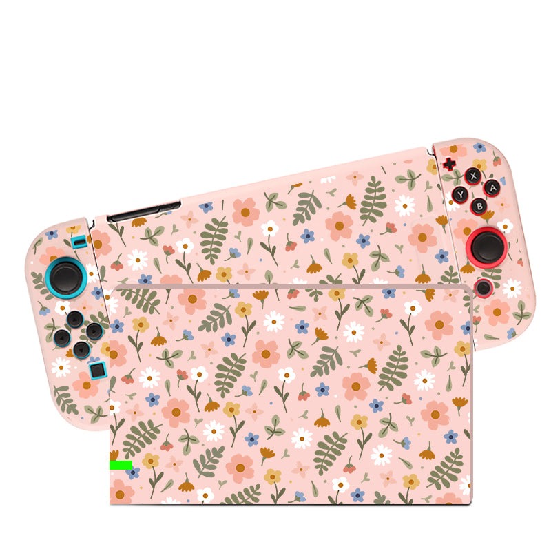The Spring Case for Nintendo Switch by petimint is a handheld gaming console accessory with detachable controllers, featuring a pink floral pattern. The design showcases various flowers and leaves in shades of pink, white, orange, blue, and green, creating a cheerful botanical theme perfect for any gamer.