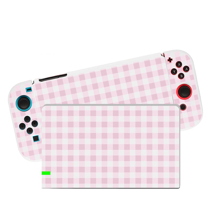 An eye-catching accessory for the cozygamer, the Picnic Case for Nintendo Switch by petimint is designed in a charming pink and white checkered pattern. It features blue and red accent buttons, black control sticks, and even displays the same stylish pattern on its screen.