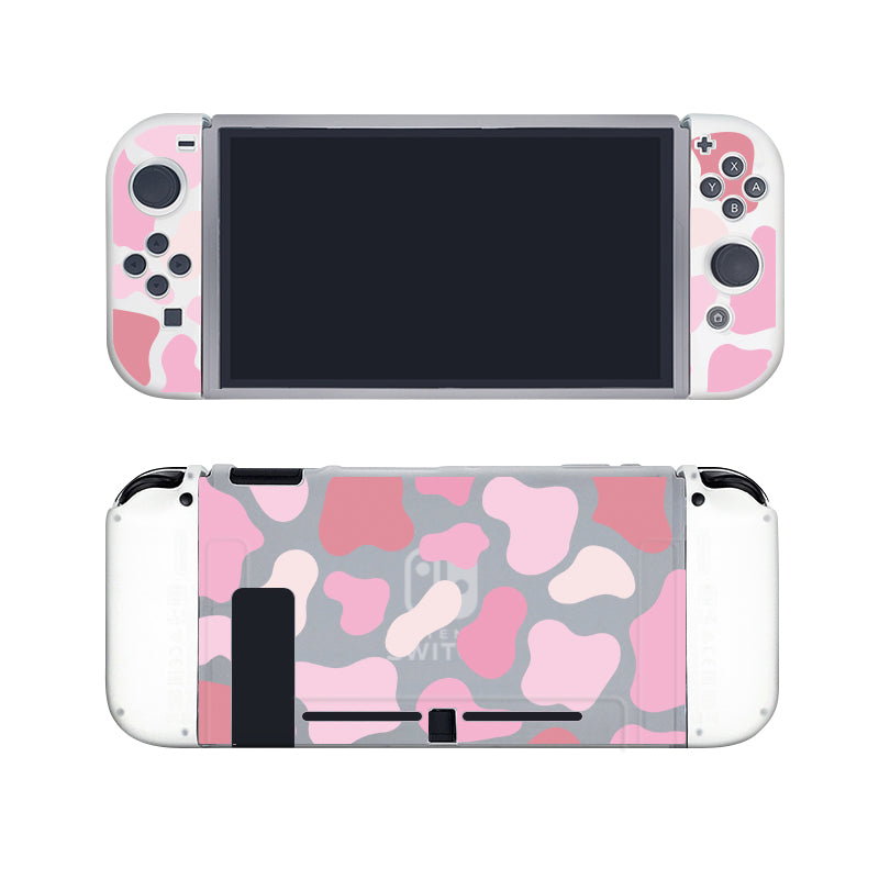 The Strawberry Cow Case for Nintendo Switch by petimint features detachable controllers with a pink and gray camouflage pattern. The console is displayed from the front and back against a white background, and includes a dockable case for convenient storage or display.