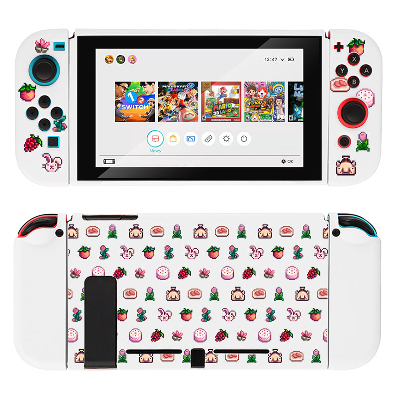 A white Nintendo Switch console adorned with the Pink Stardew Items Case by petimint, decorated with vibrant stickers of strawberries, cartoon characters, and pixel art. The screen showcases game icons such as Mario Kart 8 Deluxe and Super Mario Odyssey. The Joy-Con controllers are also white with matching stickers, creating an ideal setup for any passionate gamer.