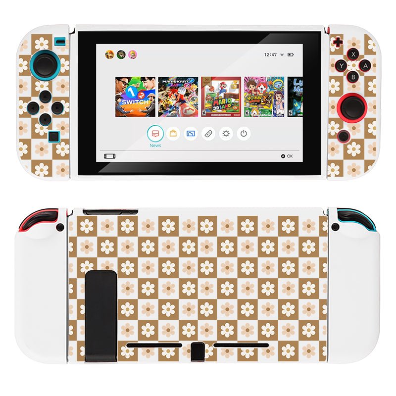 A Nintendo Switch console featuring the Cozy Checkered Flowers Case by petimint. This white case showcases a delicate floral pattern with small white flowers on a beige checkered background, all safeguarded by soft TPU material. The home screen displays various game icons, and the Joy-Con controllers are white with custom buttons.