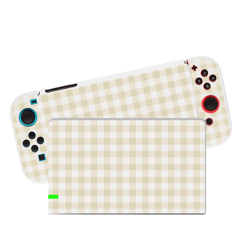 The Picnic Case for Nintendo Switch, by petimint, is covered in a beige and white checkered design. The left controller features a blue joystick and buttons, while the right includes a red joystick and buttons. The screen displays a green loading bar, all protected by the soft TPU dockable case from petimint.