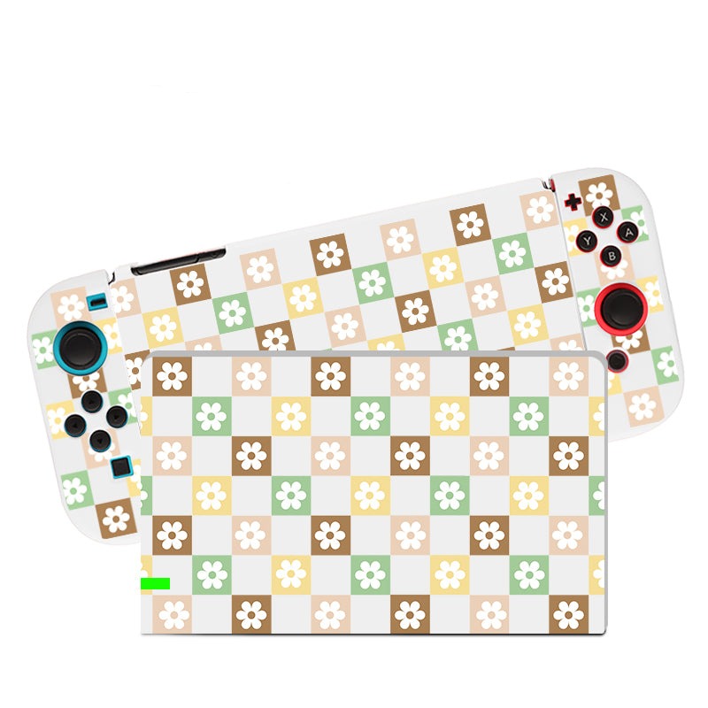 Introducing the Checkered Seasonal Flowers Case for Nintendo Switch by petimint. This delightful gaming console case features a detachable controller adorned with a whimsical pattern of white, green, yellow, brown, and beige squares. Each square is graced with a delicate white flower, creating an enchanting design. Perfect for the cozy Nintendo Switch gamer, the controller also boasts colored buttons and joysticks.