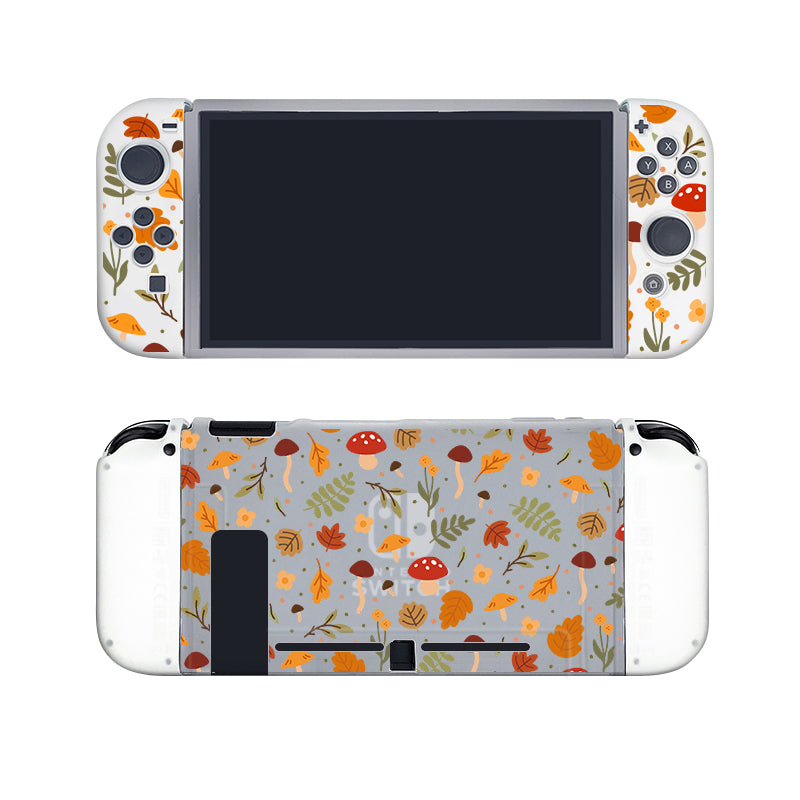 Introducing the Cozy Autumn Case for Nintendo Switch by petimint, a semi-clear, Soft TPU grip case adorned with decorative designs of autumn leaves, mushrooms, acorns, and branches on a light gray background. The front view showcases the screen and joy-cons, while the back view displays the beautiful patterned design without any screen.