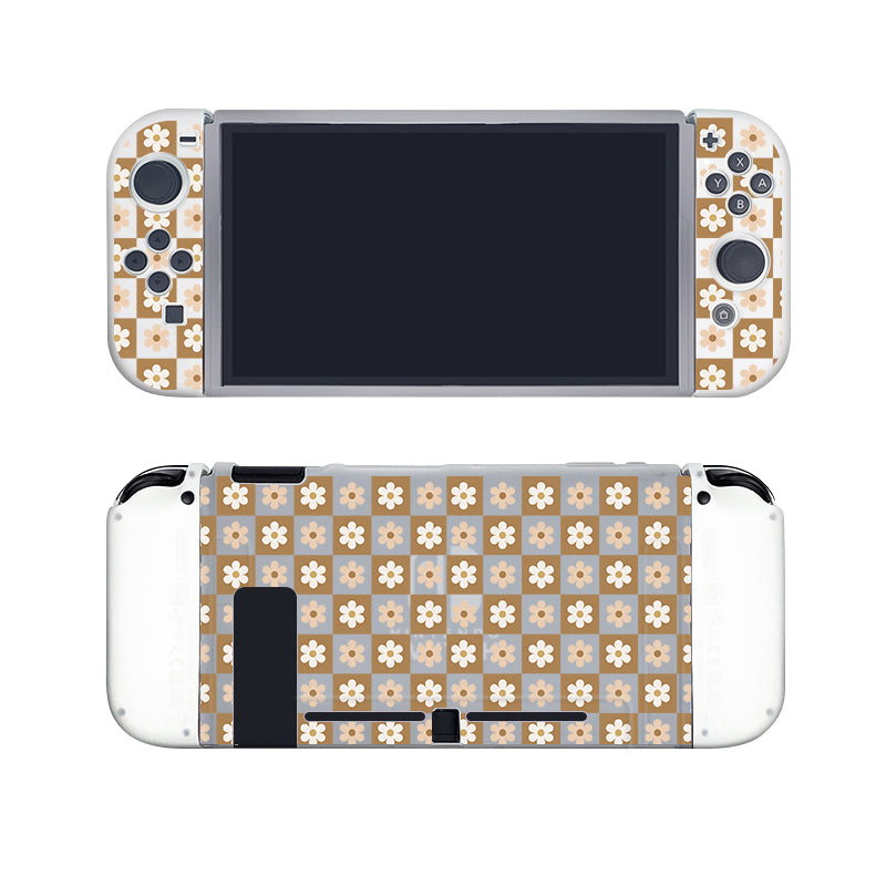 A handheld gaming console, clearly a Nintendo Switch, adorned with the Cozy Checkered Flowers Case by petimint. The semi-clear design features a beige and white flower pattern that covers both the Joy-Cons and the back of the console. With the screen turned off and Joy-Cons attached, it is encased in a sleek Dockable case made from Soft TPU material.