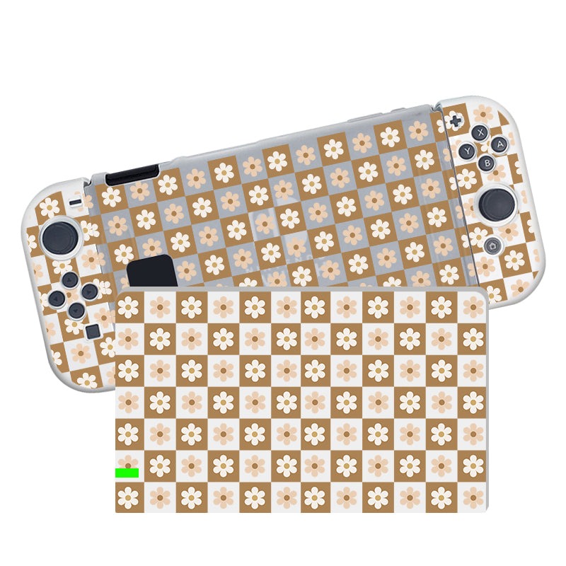 The petimint Cozy Checkered Flowers Case for Nintendo Switch is semi-clear and adorned with a charming checkered pattern showcasing tan, beige, and white squares, each featuring a white flower at its center. Crafted from soft TPU material, the case snugly fits the console, which includes various buttons and joysticks, shown from both front and back angles.