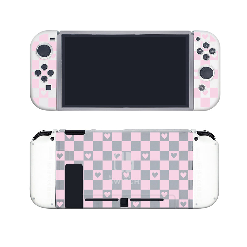 The Checkered Love Case for Nintendo Switch by petimint transforms the handheld console with a semi-clear pink and gray checkerboard design adorned with small pink hearts on the back and parts of the detachable controllers. When off, the front screen is encircled by cozygamer-themed patterned controllers.