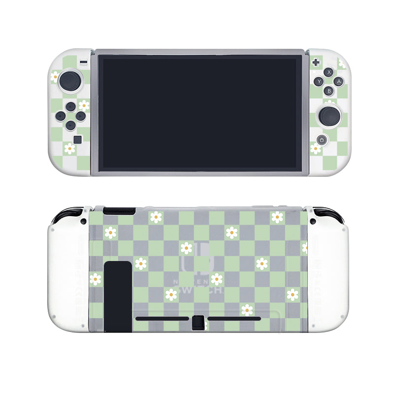 Introducing the petimint Checkered Flowers Case for Nintendo Switch, featuring a charming green and white checkered pattern embellished with small white flowers. Perfect for the cozygamer, the semi-clear case showcases the screen and control buttons from the front view, while the back view highlights the same delightful floral checkered design surrounding the console's logo.