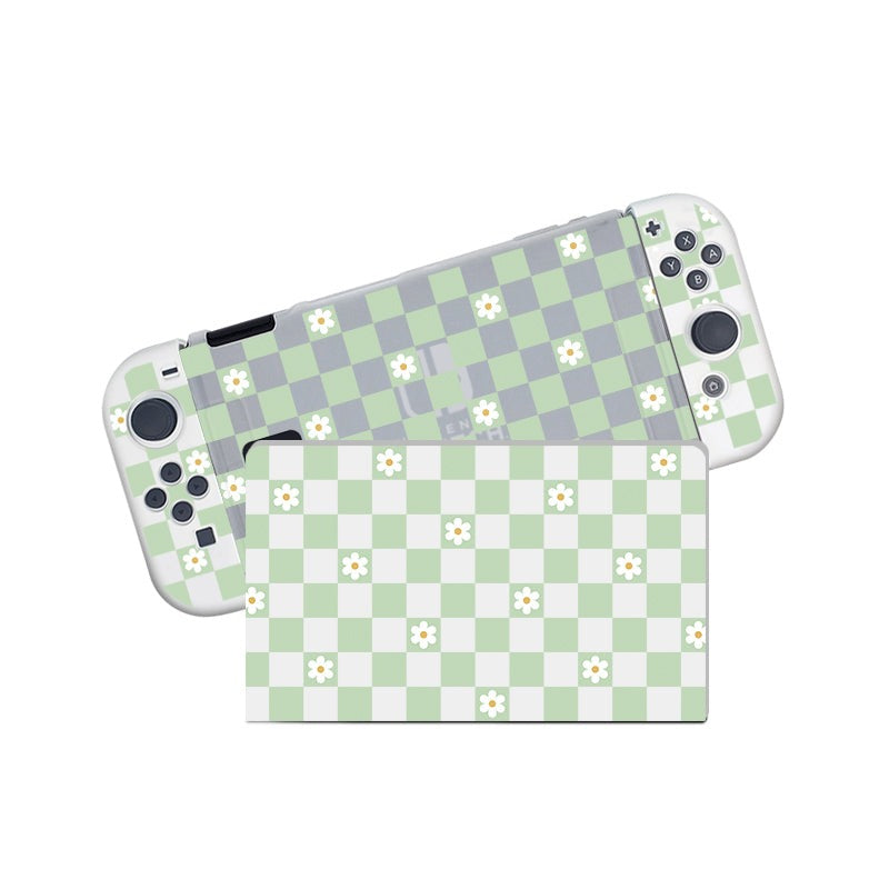 A Checkered Flowers Case for the Nintendo Switch by petimint features a semi-clear design with a green and white checkerboard pattern decorated with small white flowers. The gaming console and detachable controllers are shown in a diagonal arrangement against the background.