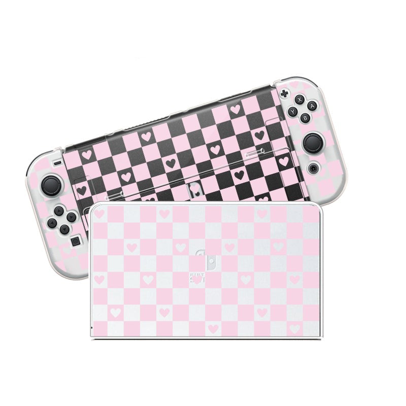 A Checkered Love Case for Nintendo Switch by petimint, showcasing a clear design with a checkerboard pattern of pink, black, and white squares adorned with heart shapes. Similar to eye-catching gamer apparel, the detached console screen displays the same pattern while side buttons remain visible.