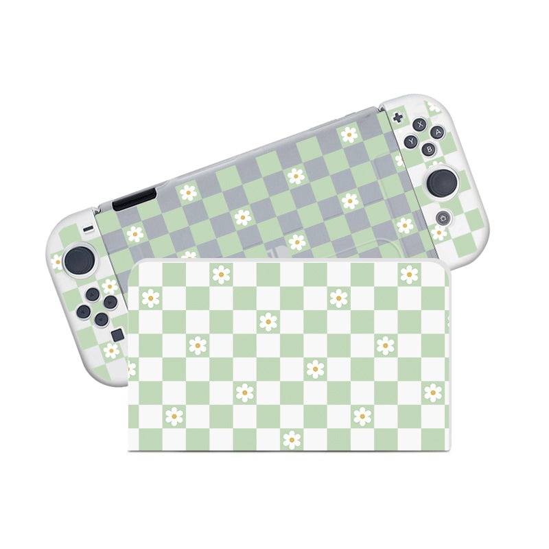Introducing the Checkered Flowers Case for Nintendo Switch by petimint. This semi-clear case features a charming green and white checkered pattern adorned with small white flower designs with yellow centers. It covers both the console screen and its two detachable controllers, making it perfect for any gamer who loves floral designs.