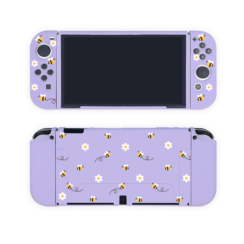 Introducing the Little Bee Case for Nintendo Switch by petimint—a stunning purple gaming console cover adorned with bee and white daisy flower patterns on both the front and back. This case features flying bees with dotted trails and scattered white daisies, perfectly paired with buttons and thumbsticks on each side of the screen. Ideal for any gamer, this eye-catching accessory enhances your Nintendo Switch experience.