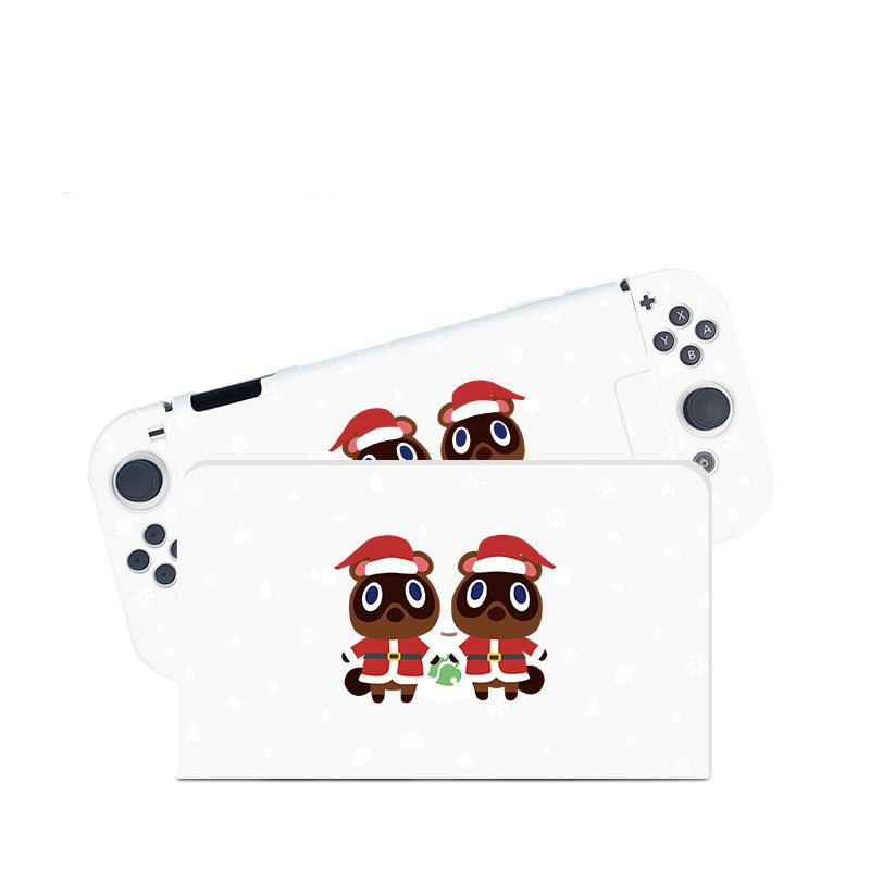 The Timmy & Tommy Christmas Case for Nintendo Switch by petimint features a design of two cartoon raccoons, Timmy and Tommy, dressed in Santa hats and red suits. These charming raccoons stand side by side, capturing the cozygamer spirit against a white background adorned with light grey snowflakes.