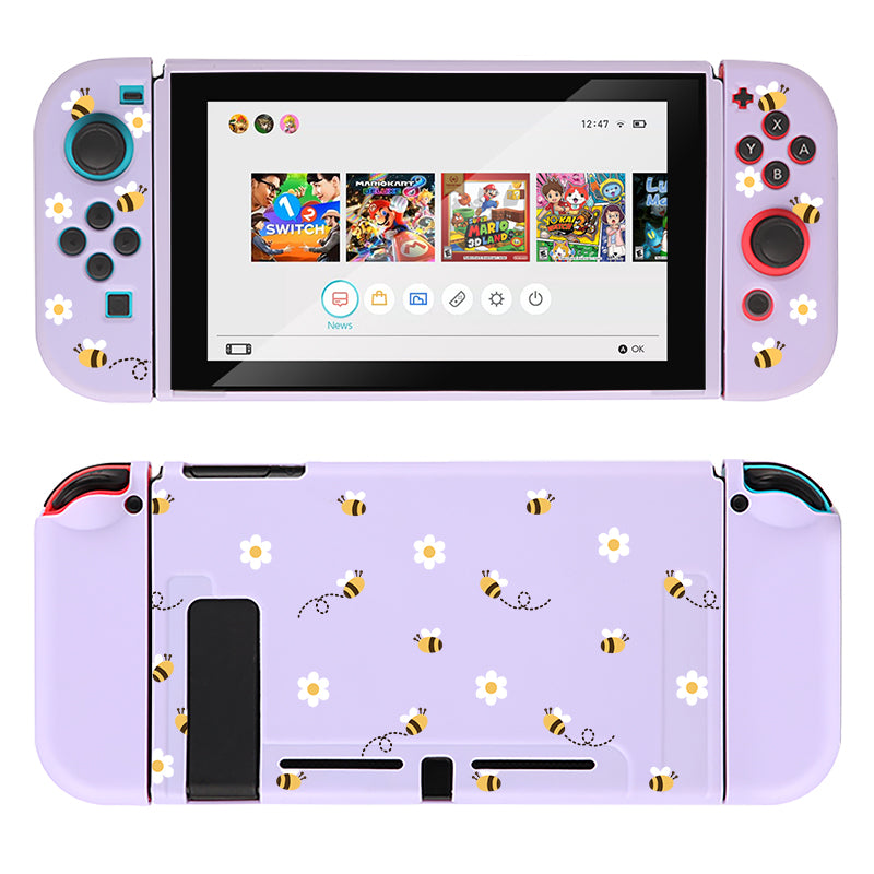 The Little Bee Case for Nintendo Switch by petimint, in a charming lavender hue, is perfect for any gamer. It features delightful bee and daisy patterns on both the front and back, evoking a whimsical touch. The front display showcases a selection of games and includes red and blue buttons for an enhanced gaming experience.