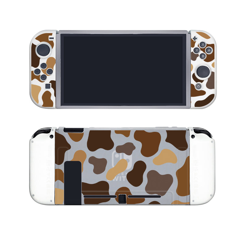 Introducing the Moka Cow Case for Nintendo Switch by petimint—a semi-clear handheld gaming console case adorned with an adorable brown, tan, and white cow-print design. Perfect for the cozygamer, this case showcases a screen-centric front, flanked by control buttons and joysticks on either side. Enhance your gaming experience with this charming accessory ideal for any gamer.