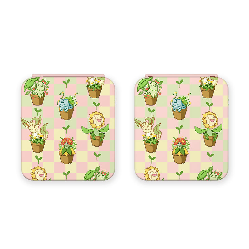 A charming pink image with a checkered background is adorned with various green leaf and flower designs. In this whimsical pattern, some leaves and adorable Pokémon characters cheerfully hold flowerpots with plants. The playful design of the petimint Pokepots Game Card Box for Nintendo Switch exudes a lively and cozygamer vibe, making it perfect for stylish apparel or accessories.