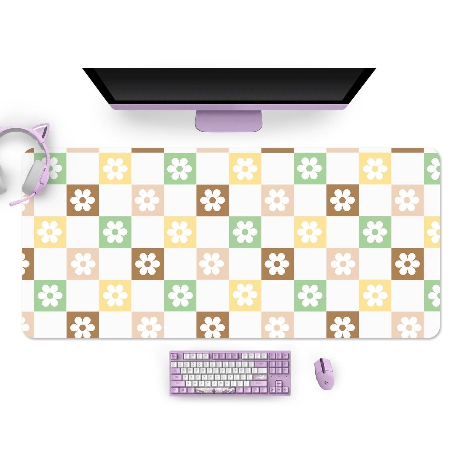 A desktop setup featuring a widescreen monitor, lavender headphones, a matching lavender keyboard and mouse. The desk mat is adorned with the colorful pattern of the Checkered Seasonal Flowers Mouse Pads PC Gaming Accessories by petimint, featuring beige, brown, green, and yellow squares with flower designs. Ideal for any gamer is the Nintendo Switch neatly placed beside the monitor.