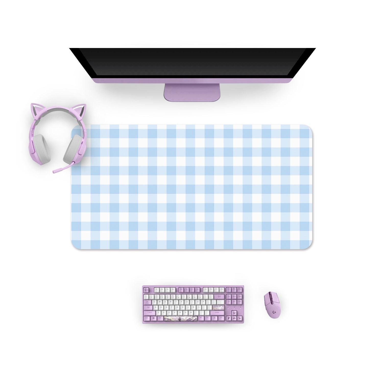 A cozygamer's dream setup featuring a monitor on a large blue Picnic Mouse Pads Pc Gaming Accessories mat by petimint, alongside a pastel purple keyboard and mouse. A pair of purple headphones with cat ears rests stylishly on the left side of the desk mat.