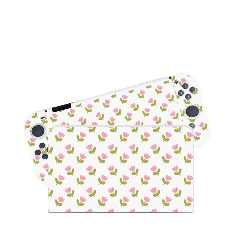 The petimint Pink Tulips Case for Nintendo Switch is perfect for the cozygamer. This handheld gaming console case features a floral design with small pink tulips and green leaves on a white background, giving it a soft, inviting look. The console boasts side buttons and thumbsticks for seamless gameplay.